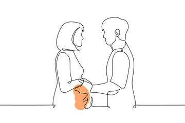 pregnant woman and man looking at each other holding hands - one line drawing vector. concept of a heterosexual couple expecting a baby, the relationship of future parents, support during pregnancy