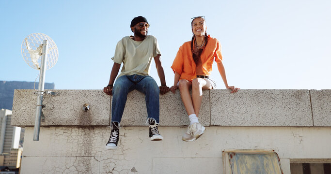 Rooftop, relax and friends for social conversation together in cool wind, sunshine and blue sky mock up space for advertising gen z youth aesthetic. Happy black people couple on urban city building