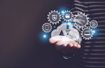 Selective focus at the icon with hand of human that holding cloud icon while who using internet and...