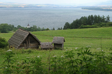 Wooden buildings in Havranok archaeological site in northern Slovakia
