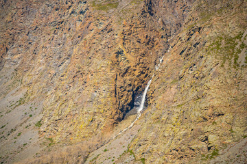 View from mountain pass Katu-Yaryk of waterfall, which falls from a cliff in, Altai, Russia