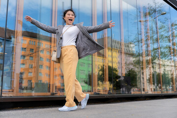 carefree asian traveller female woman casual cloth happiness lifestyle walking sight seeing on walkway footpath in Vienna Austria, asia woman traveller enjoy spending vacation time in Vienna Austria