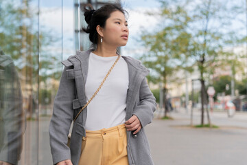 carefree asian traveller female woman casual cloth happiness lifestyle walking sight seeing on walkway footpath in Vienna Austria, asia woman traveller enjoy spending vacation time in Vienna Austria