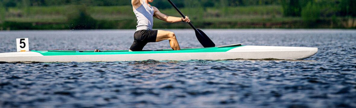 athlete canoeist rowing in canoe competition race