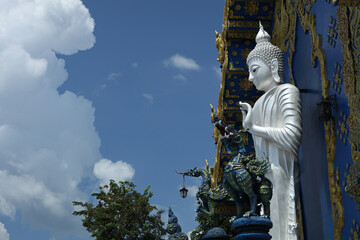 Buddha statue near Wat Rong Suea Ten (The Blue temple) in Chiang Rai, Thailand