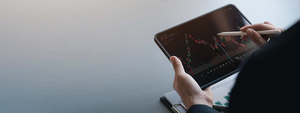 Stock price charts and stock market analysis, stock trading technology and digital assets, investors analyzing stock charts for profitable trading. Money growth. The idea of investing money to grow.