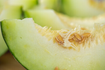 Honeydew melon and Japanese melon slice fresh ripe orange and sweet green slice lay on leaf in plant. Melon or cantaloupe is sweet fruit dessert.