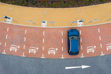 Aerial view of an electric car charging station with parking spaces