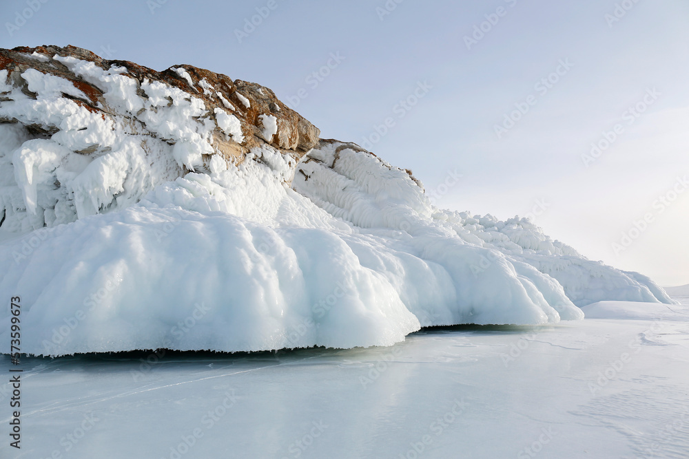 Wall mural rocks in ice splashes on Baikal