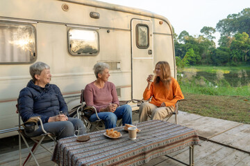 Happy family eating breakfast at tent camping.