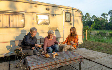 Happy family eating breakfast at tent camping.