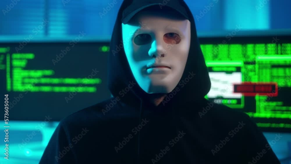 Poster portrait of a hacker in a white mask confidently looking at the camera and crosses his arms. a man i