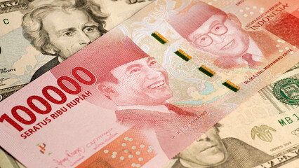 Indonesian rupiah and us dollar bill