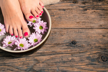 Obraz na płótnie Canvas Close up of a female feet in spa salon