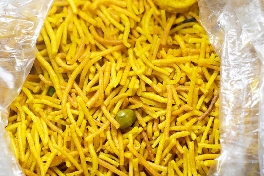 Bombay mix or Chanachur or Chiwda or farsan is a snack mix,it's made by maida or flour and different's types of spicy. Bombay mix is a popular tea-time food in asia.