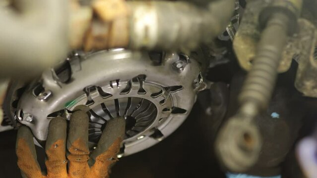 installation of a new clutch kit in the car gearbox.