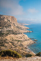 Fototapeta na wymiar Cliffs and sea shore in Matala, Crete, Greece