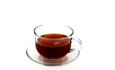 Glass cup with black fragrant tea on a white background