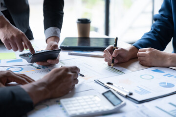 Asian business people brainstorming in a graph analytical computing plan meeting. data chart Marketing growth. Finance. The concept of business success statistics.