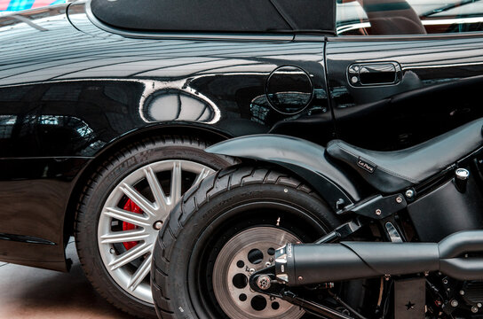 Dusseldorf, Germany – Apr 17, 2015: Detail stylish black car and motorcycle in vintage car shop-museum Classic Remise in Dusseldorf.