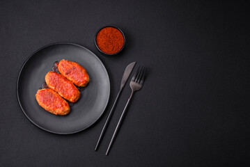 Meat cutlet or meatballs in tomato sauce with garlic, salt, spices and herbs