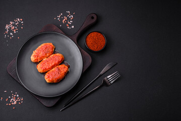 Meat cutlet or meatballs in tomato sauce with garlic, salt, spices and herbs