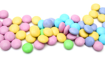 Closeup of colorful chocolate candies on white 