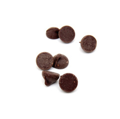 Close up pile of chocolate morsels on white background - 573619871