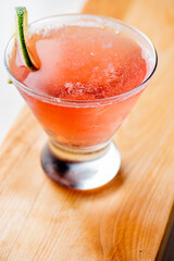 Cosmopolitan cocktail. Cosmo cocktail, is a cocktail made with vodka, Cointreau, cranberry juice, and freshly squeezed or sweetened lime juice. Classic drink made famous on popular TV shows. 