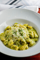 Gnocchi. Pesto gnocchi Pasta sautéed with truffles garlic, onions, olive oil and fresh herbs and spices. Classic American steakhouse or French bistro appetizer or side dish.