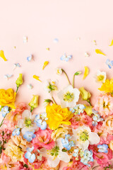 Spring Flowers composition on pastel pink background. Floral concept for Easter, Woman's day or...