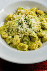 Gnocchi. Pesto gnocchi Pasta sautéed with truffles garlic, onions, olive oil and fresh herbs and spices. Classic American steakhouse or French bistro appetizer or side dish.