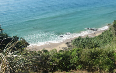 Another beautiful view of a beach in Balneario Camboriu. Emerald green sea and constant waves.