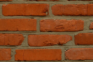 Background: a wall of fire-resistant red bricks