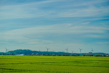 Fototapeta na wymiar 風力発電がある田舎の風景