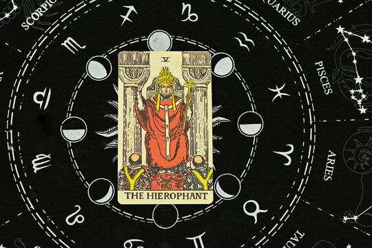 Bangkok, thailand, 14 Feb 23, tarot cards spreading flat lay, Raider wait tarot deck, major arcana, The Hierophant on the astrology zodiac horoscope constellation background.