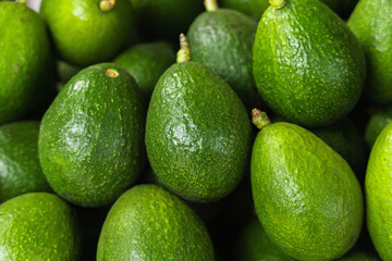 fresh avocado on the market. avocados are very nutritious and contain a wide variety of nutrients.