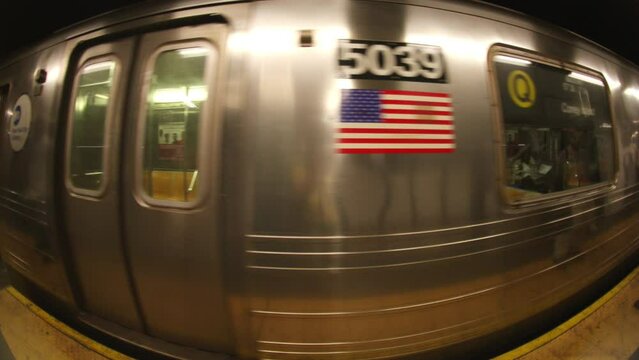 new york subway train coming into the station