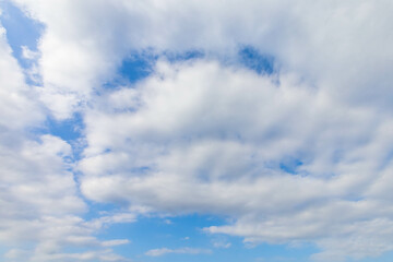 Blue sky with fluffy cumulus clouds floating in summer day. Pure white soft cloudscape scene, beautiful abstract in the air. Cloudy space view background. Tranquil environment, nature outdoor. Freedom