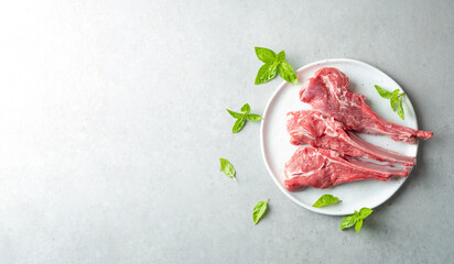 Raw lamb ribs on a plate