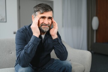 Elderly men with headache indoor