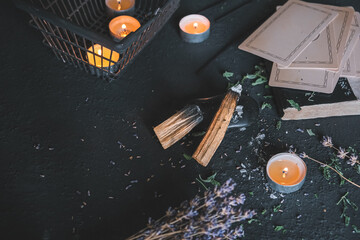 Esoteric, Occult mystical ritual scene of sorcery tarot candles, dried flowers, palo santo and...