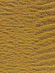 sand texture as a background. yellow sand for designers