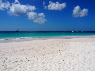 Caribbean ocean and sand. beautiful turquoise water with blue sky