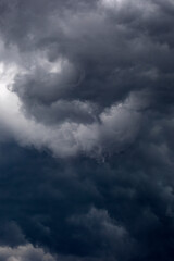 Naklejka na ściany i meble stormy clouds in the sky, dramatic weather