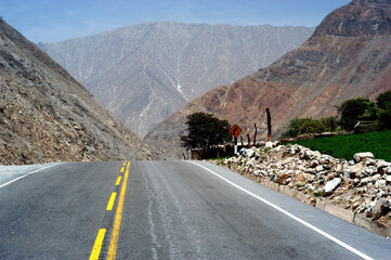 ayacucho peru mountain with curve on the road with asphalt in blue sky may 2020