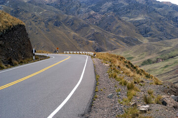 ayacucho peru mountain with curve on the road with asphalt in blue sky may 2020