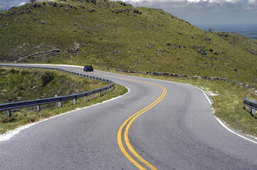 asphalt road with curves aerial view without transportation on a mountain in the province of san...