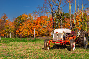 old tractor in autumn landscape