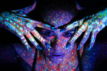 Model woman in neon light, beautiful model girl with fluorescent makeup, art design of disco dancer...